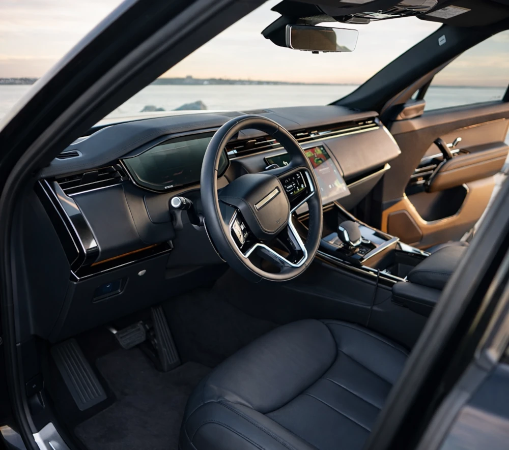 Range Rover Sport luxury interior with steering wheel, dashboard and center console
