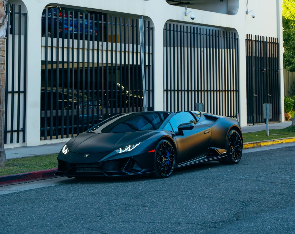 Black Lamborghini Huracan EVO - front three-quarter view with blue interior